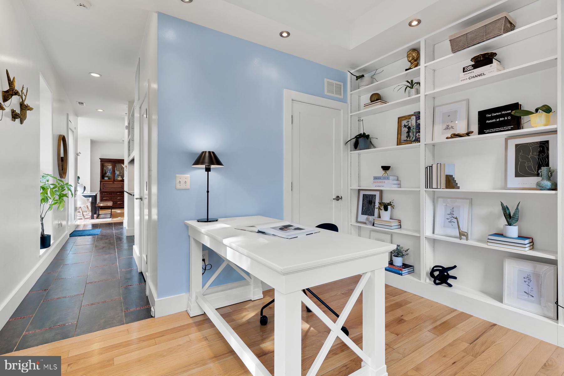 801 Q Street Northwest, Unit 1 Washington, DC 20001 - Photo 5 of 39 a view of kitchen island with furniture and wooden floor