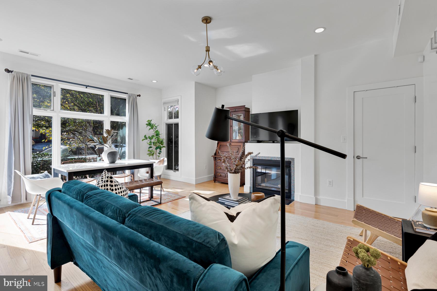 801 Q Street Northwest, Unit 1 Washington, DC 20001 - Photo 10 of 39 a living room with furniture and a large window