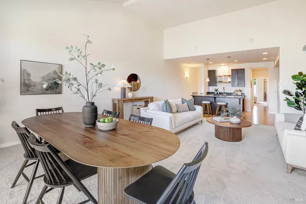 a view of a dining room and livingroom with furniture