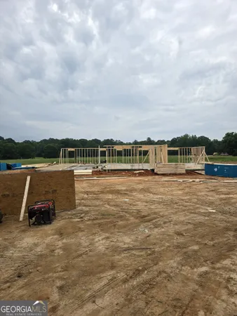 a view of a lake with houses in the back