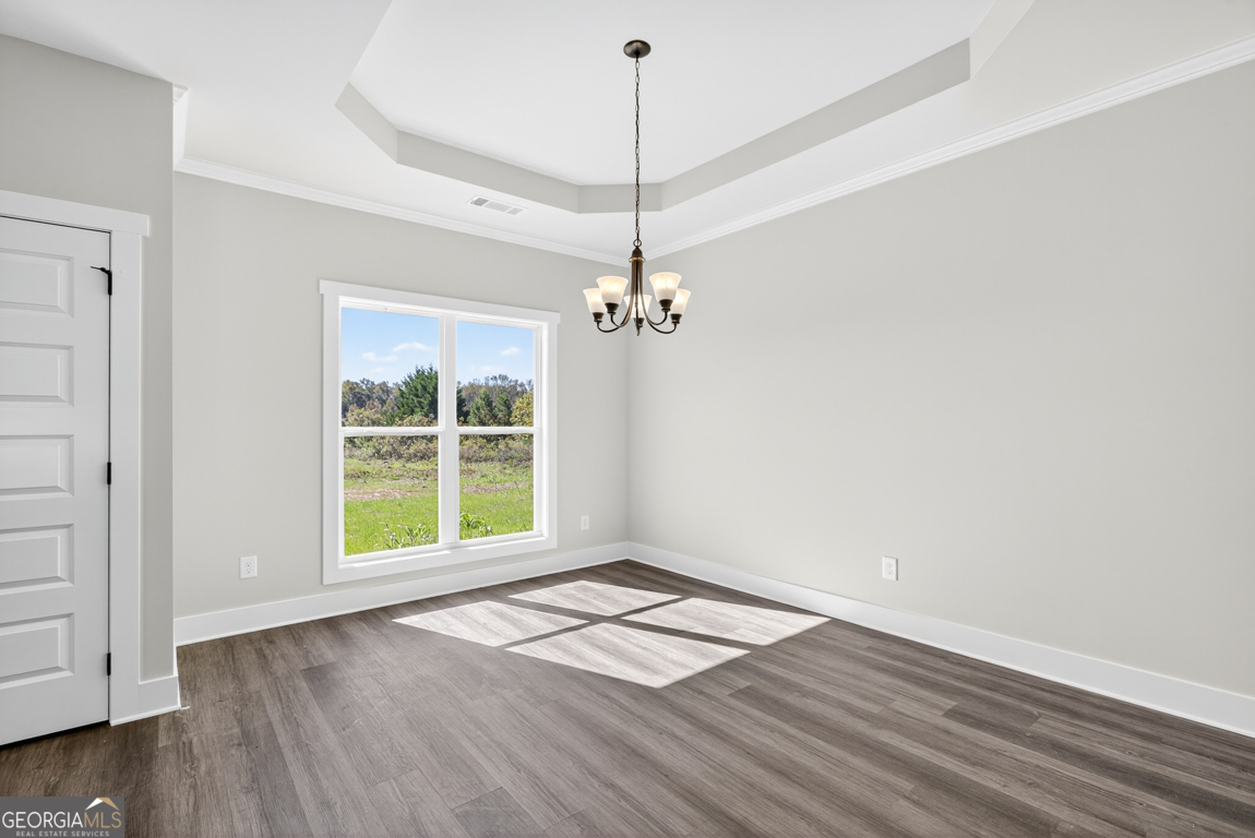 2611 Bethany Bowersville Road, Unit 5 Canon, GA 30520 - Photo 17 of 47 a view of an empty room with wooden floor and a window
