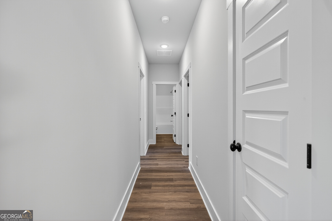 2611 Bethany Bowersville Road, Unit 5 Canon, GA 30520 - Photo 26 of 47 a view of a hallway with wooden floor and staircase