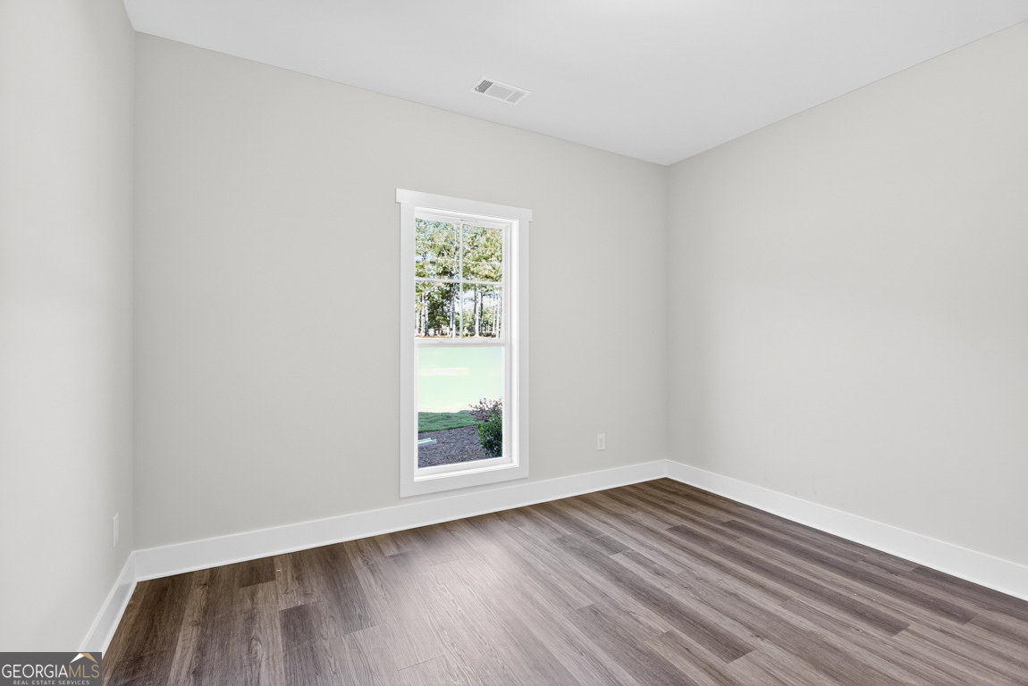 2611 Bethany Bowersville Road, Unit 5 Canon, GA 30520 - Photo 32 of 47 an empty room with wooden floor and windows