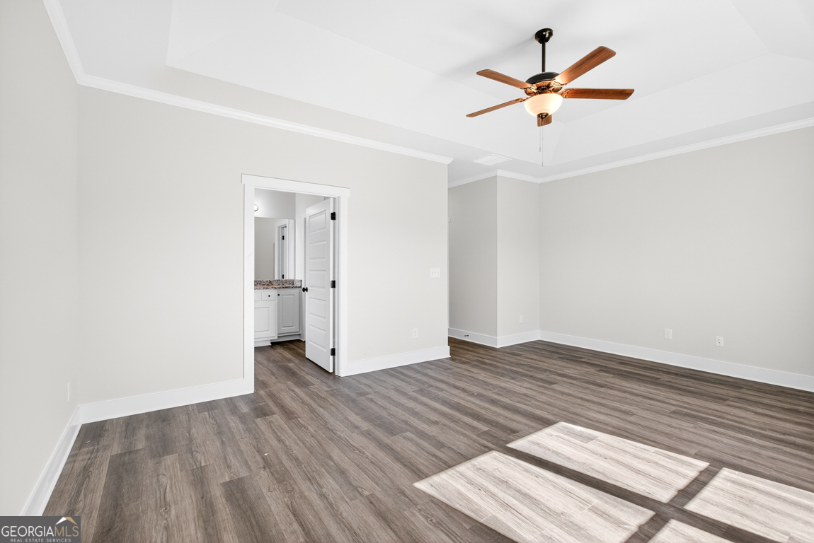 2611 Bethany Bowersville Road, Unit 5 Canon, GA 30520 - Photo 40 of 47 an empty room with wooden floor and a ceiling fan