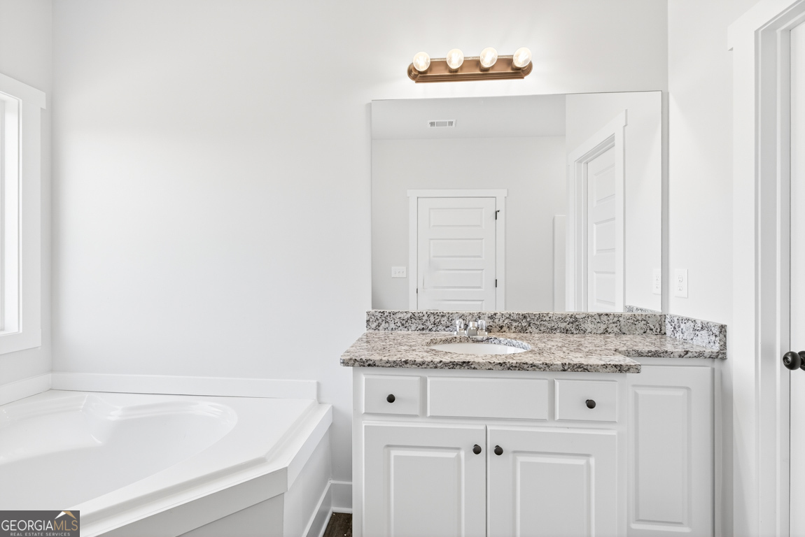 2611 Bethany Bowersville Road, Unit 5 Canon, GA 30520 - Photo 44 of 47 a bathroom with a sink and a bathtub