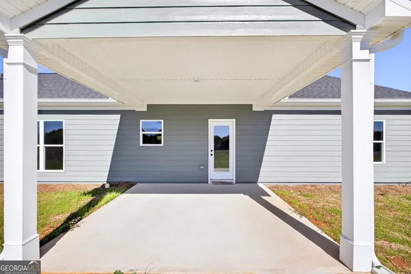 a front view of a house with a large window