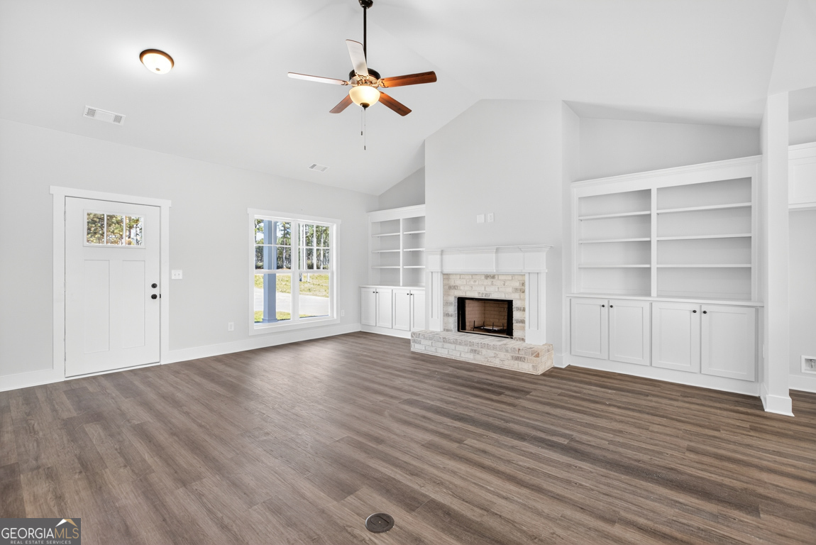2611 Bethany Bowersville Road, Unit 5 Canon, GA 30520 - Photo 8 of 47 a view of an empty room with wooden floor fireplace and a window