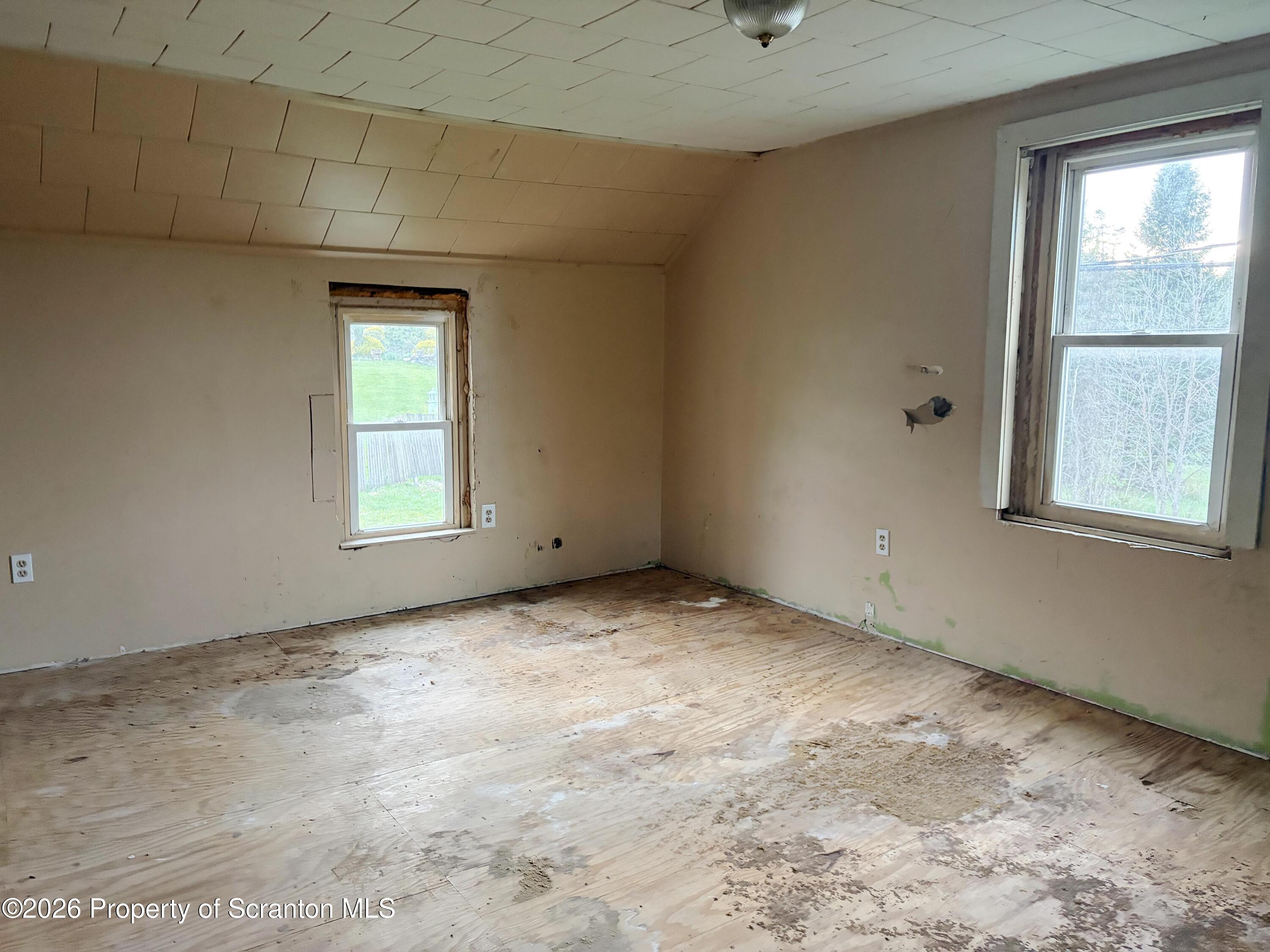 2466 State Rte 4002 Mehoopany, PA 18629 - Photo 9 of 11 an empty room with windows
