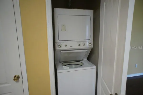 a view of bathroom with a washer and dryer