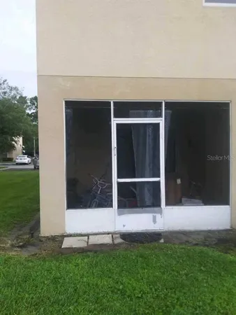 a view of front door and yard