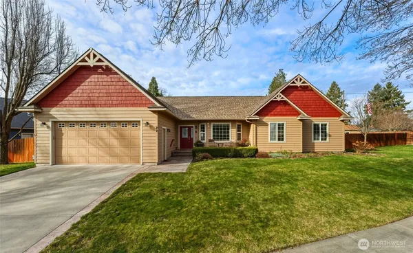 a front view of a house with yard