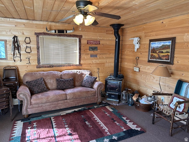 1454 East Little Sweden Road Heber City, UT 84032 - Photo 33 of 35 Carpeted living area featuring a wood stove, wooden walls, ceiling fan, and wooden ceiling
