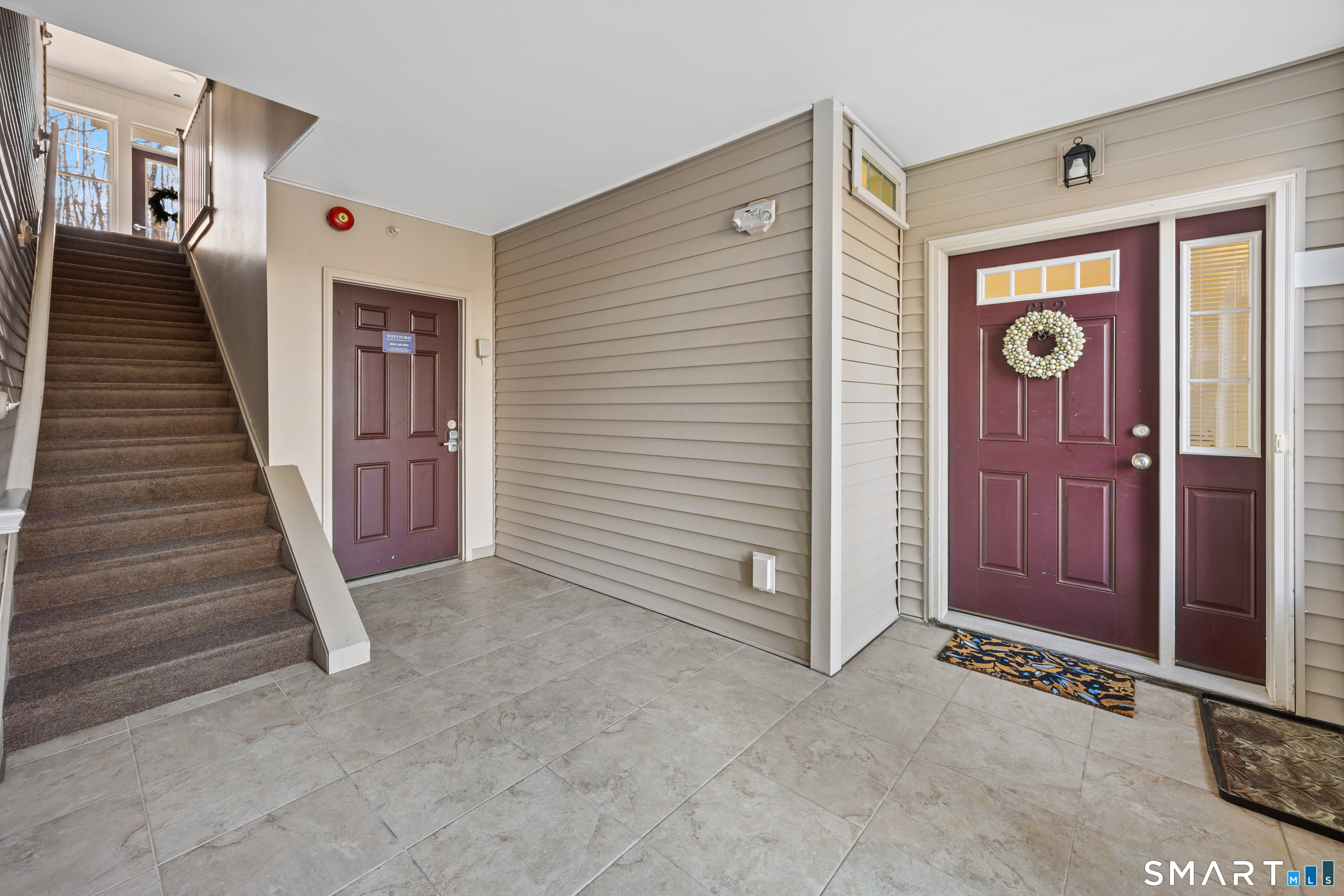 95 South Ridge Lane, Unit FGL2 Berlin, CT 06037 - Photo 5 of 33 a view of a hallway with entryway wooden floor and windows