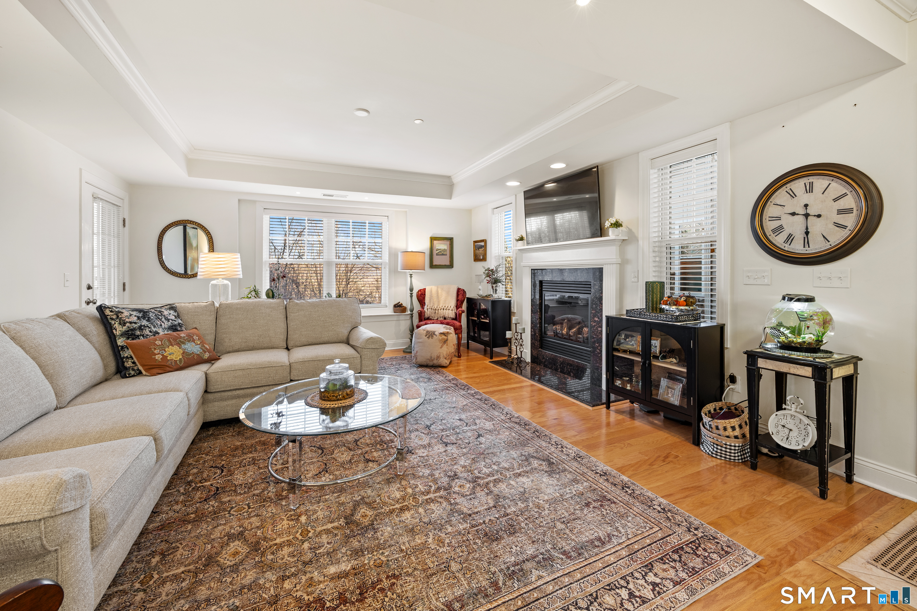 95 South Ridge Lane, Unit FGL2 Berlin, CT 06037 - Photo 7 of 33 a living room with furniture a clock and a table