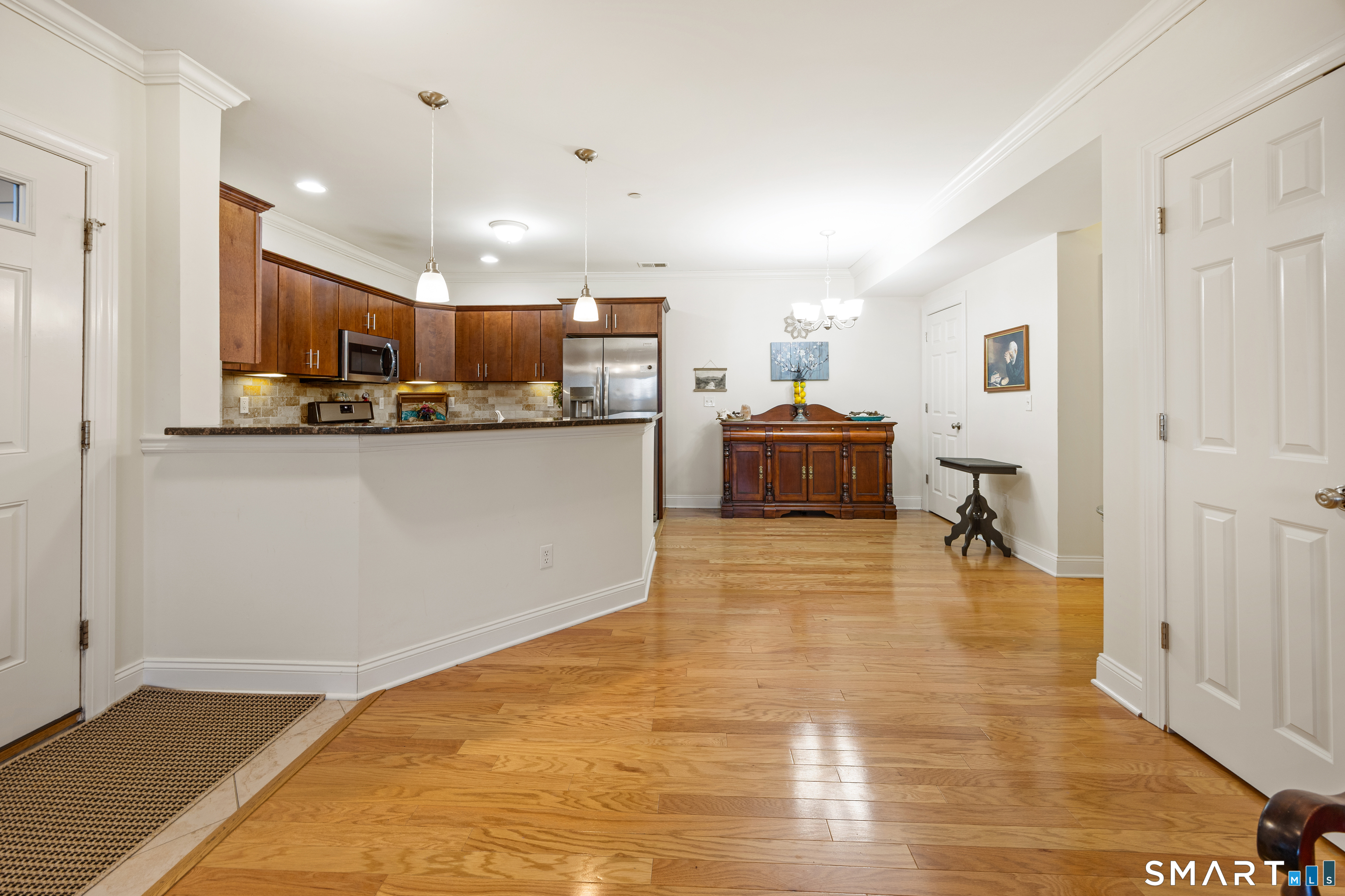 95 South Ridge Lane, Unit FGL2 Berlin, CT 06037 - Photo 9 of 33 a view of kitchen and living room with wooden floor