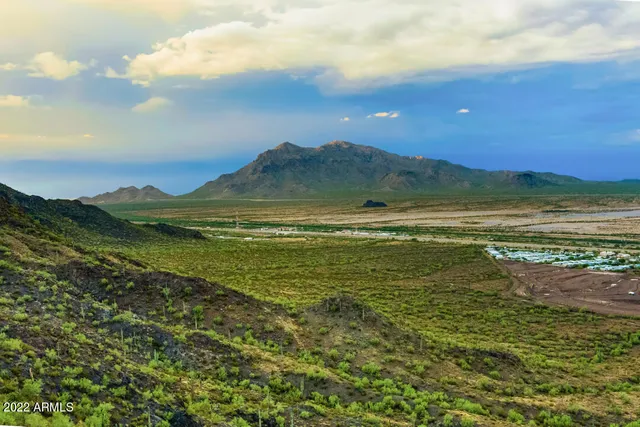 a view of an ocean and a mountain