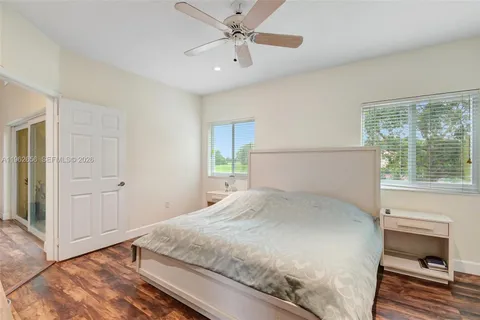 a white toilet sitting next to a shower curtain