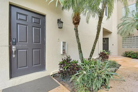 a car parked in front of white house