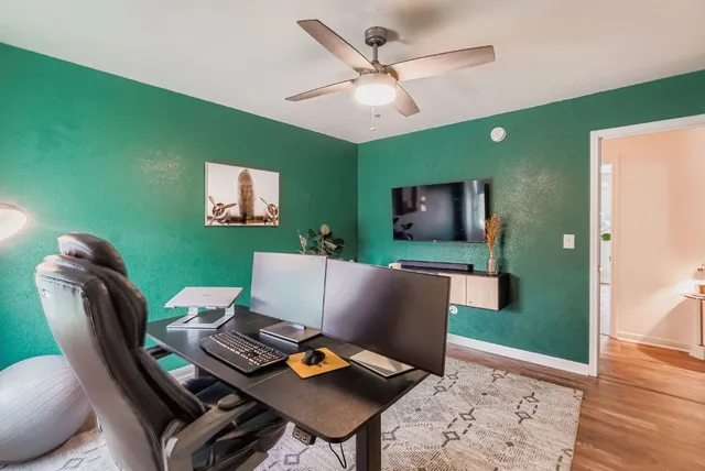 a workspace with furniture and a potted plant