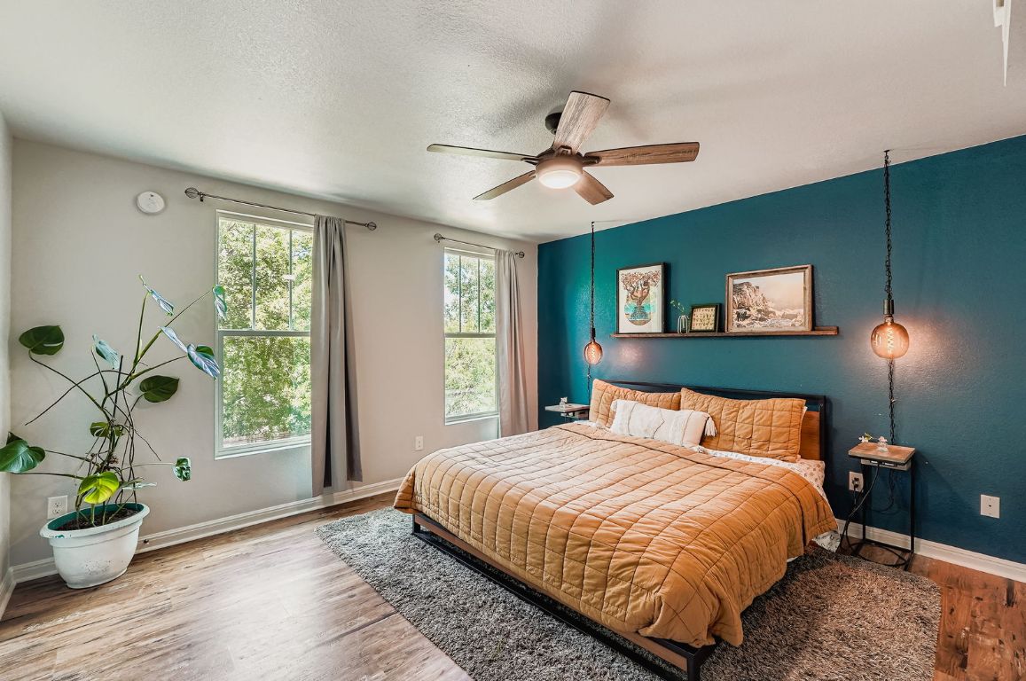 229 Ferrule Drive Kyle, TX 78640 - Photo 16 of 28 a bedroom with a bed and a window