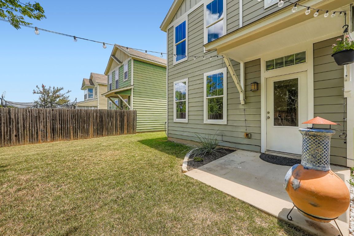 229 Ferrule Drive Kyle, TX 78640 - Photo 24 of 28 a backyard of a house with seating space