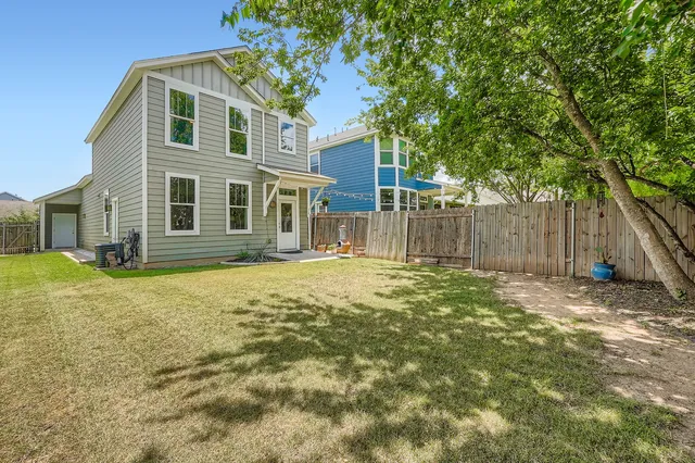 a backyard of a house with seating space