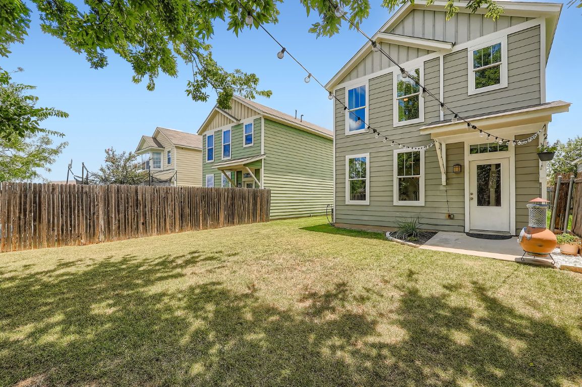 229 Ferrule Drive Kyle, TX 78640 - Photo 26 of 28 a front view of a house with a garden
