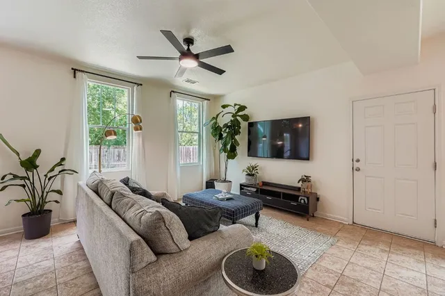 a living room with furniture and a window