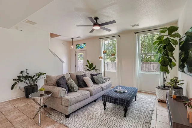 a living room with furniture and a large window