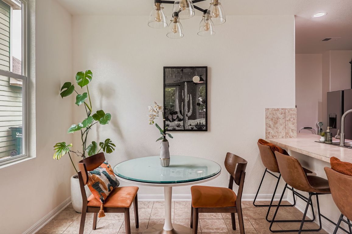 229 Ferrule Drive Kyle, TX 78640 - Photo 9 of 28 a view of a dining room with furniture window and wooden floor