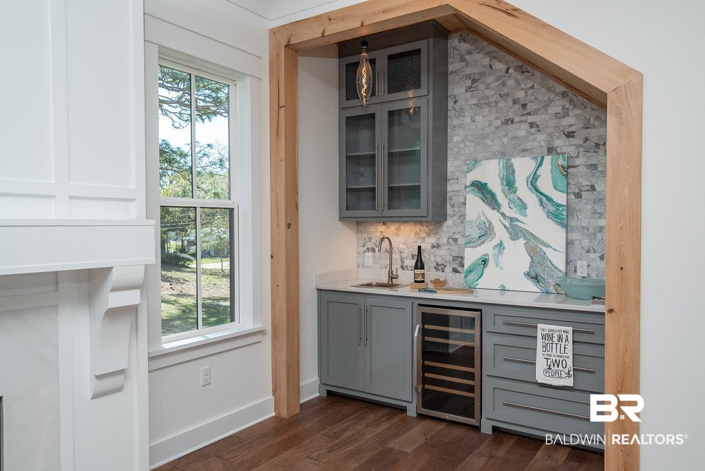 389 Pecan Avenue Fairhope, AL 36532 - Photo 9 of 50 Beautiful marble backsplash, sink & wine cooler!