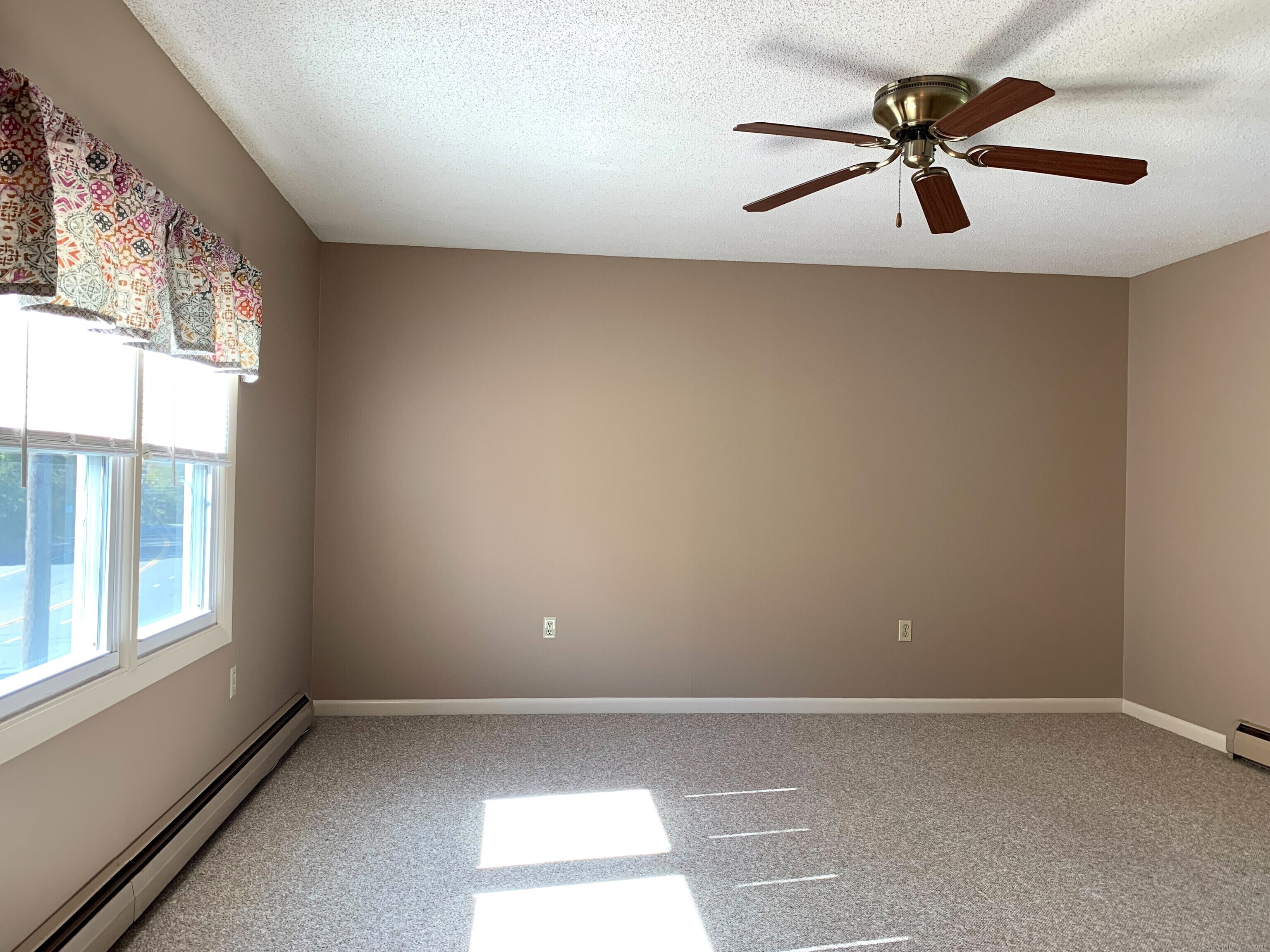 96 Main Street, Unit 2 Branford, CT 06405 - Photo 3 of 10 a view of an empty room with a window
