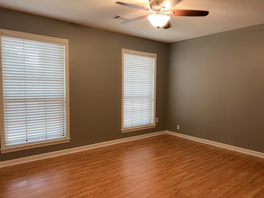 7935 Memphis Arlington Road Bartlett, TN 38133 - Photo 12 of 20 Neutral painted walls and wood-finish flooring define this interior space