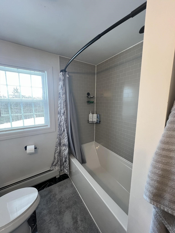 313-315 Walnut Hill Road Orange, MA 01364 - Photo 11 of 19 a bathroom with a bathtub a window and a shower