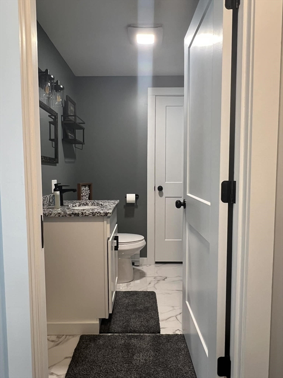313-315 Walnut Hill Road Orange, MA 01364 - Photo 12 of 19 a bathroom with a sink and a mirror