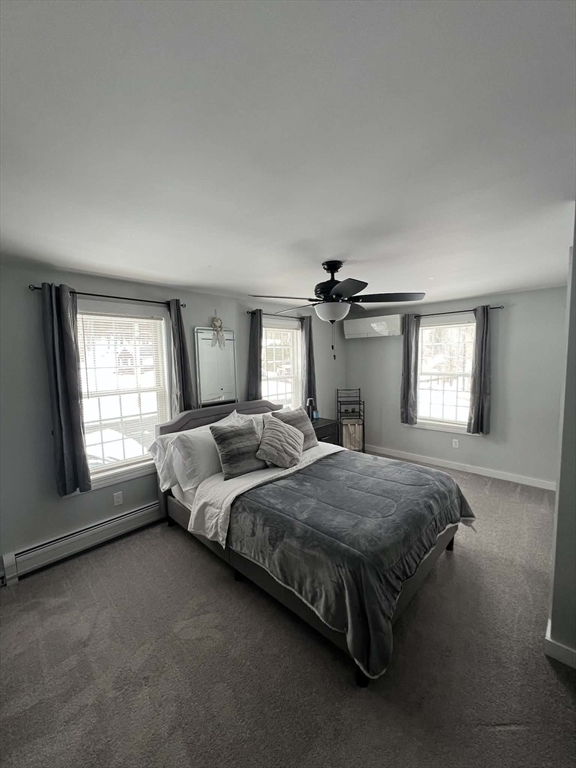 313-315 Walnut Hill Road Orange, MA 01364 - Photo 15 of 19 a spacious bedroom with a bed lamp and window
