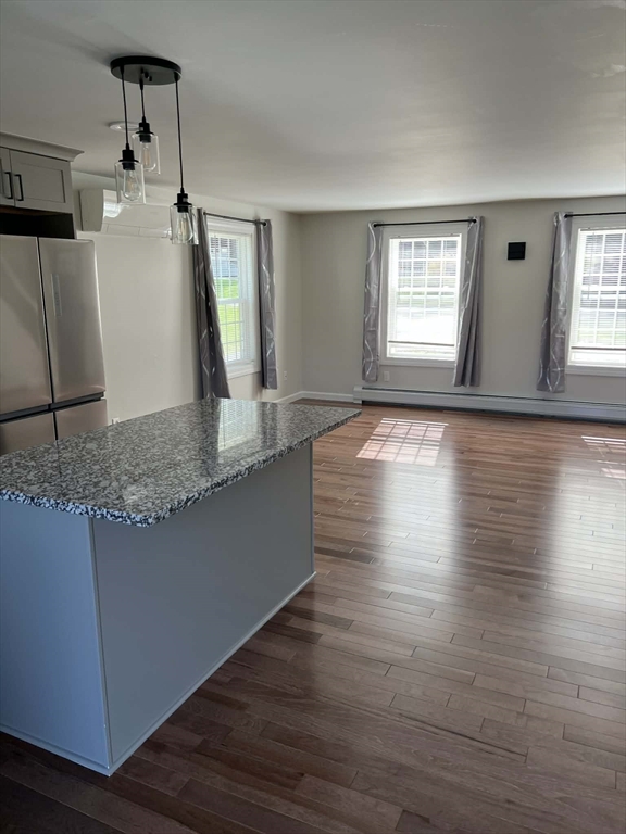 313-315 Walnut Hill Road Orange, MA 01364 - Photo 7 of 19 a view of a kitchen and wooden floor