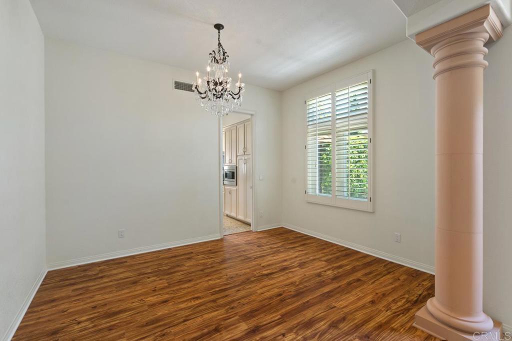 5402 Renaissance Avenue San Diego, CA 92122 - Photo 17 of 73 a view of a room with a window and wooden floor