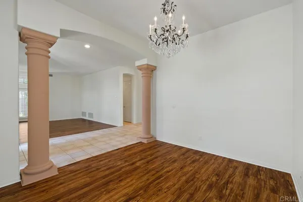a view of entryway and hall with a door