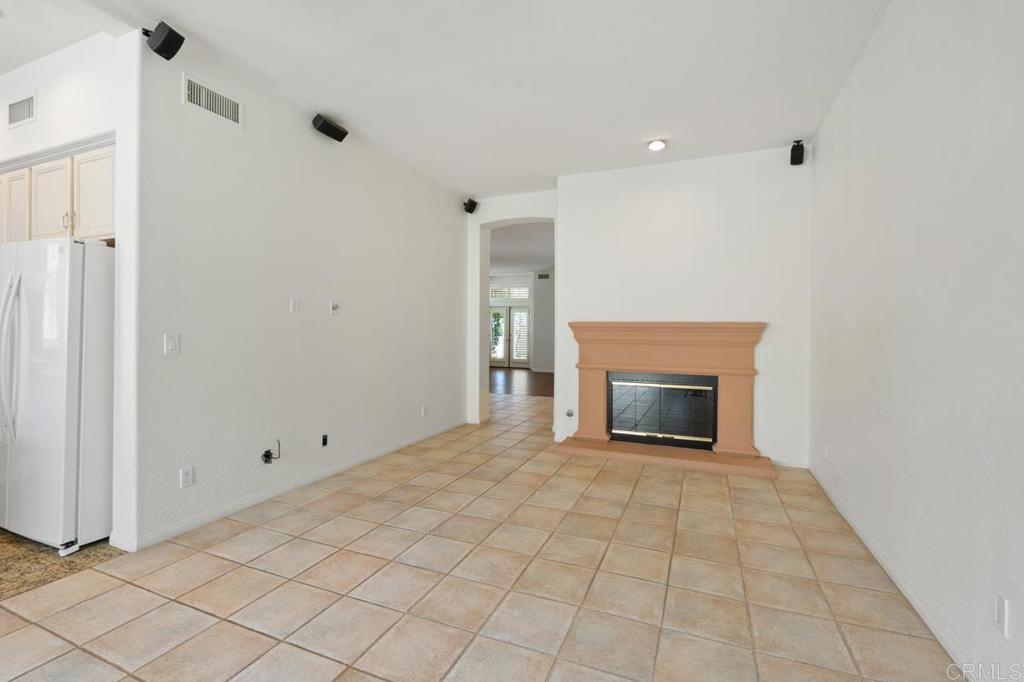 5402 Renaissance Avenue San Diego, CA 92122 - Photo 22 of 73 a view of an empty room with a fireplace