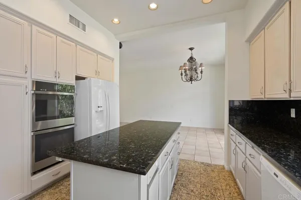 a spacious bathroom with a double vanity sink mirror and double