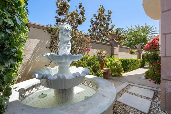 a potted plant sitting in front of a house
