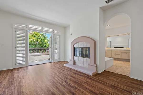 a bathroom with a sink toilet vanity tub and shower
