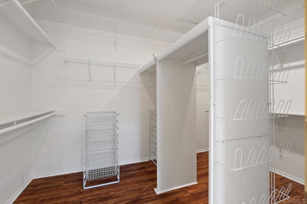 5402 Renaissance Avenue San Diego, CA 92122 - Photo 42 of 73 a view of walk in closet with wooden floor