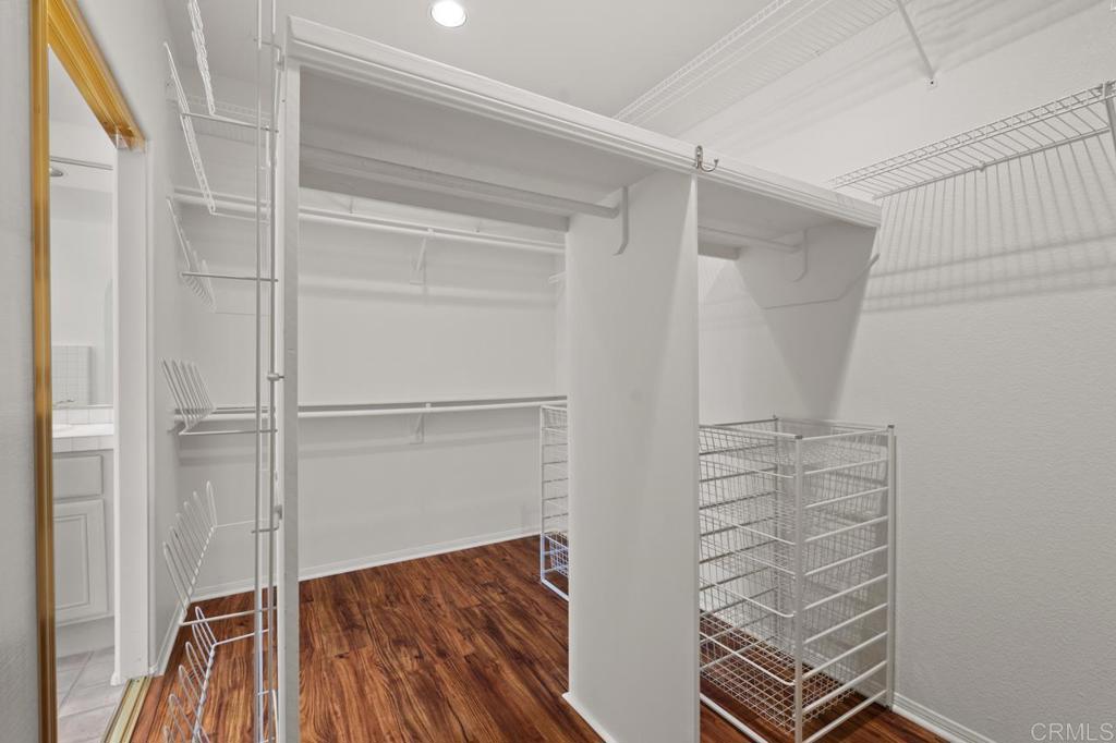 5402 Renaissance Avenue San Diego, CA 92122 - Photo 43 of 73 a view of walk in closet with empty racks