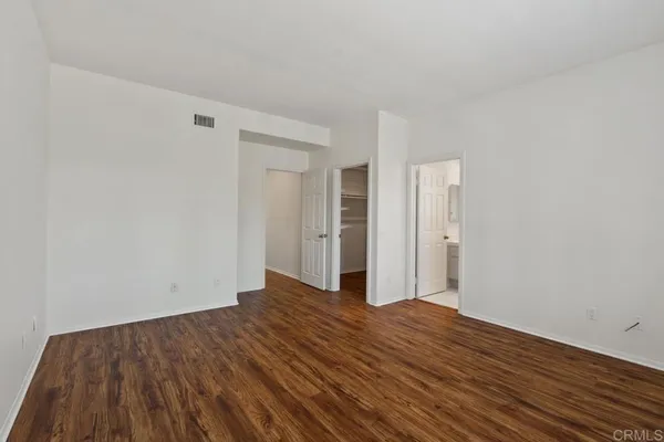 a front view of a house with a yard and outdoor seating