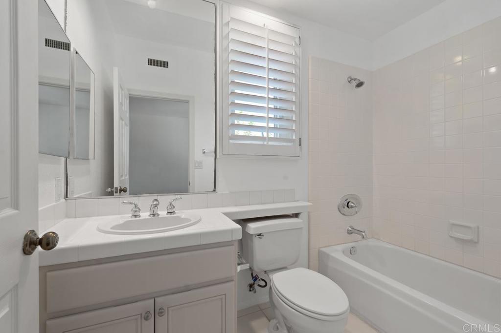 5402 Renaissance Avenue San Diego, CA 92122 - Photo 47 of 73 a bathroom with a sink toilet vanity tub and shower