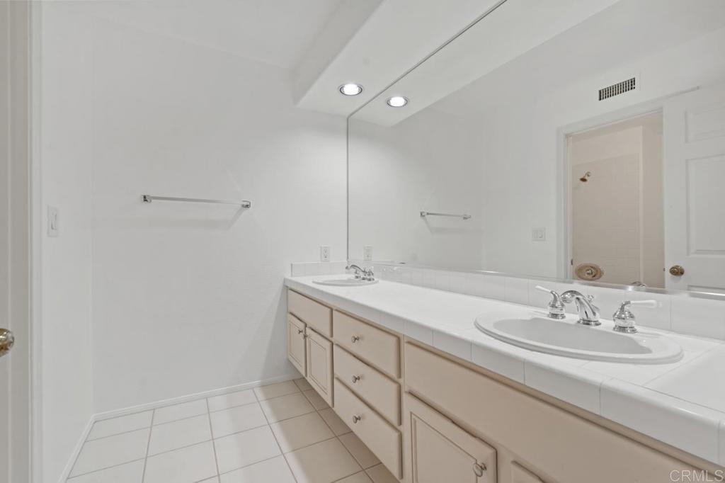 5402 Renaissance Avenue San Diego, CA 92122 - Photo 49 of 73 a bathroom with a sink and a mirror