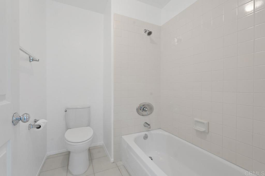 5402 Renaissance Avenue San Diego, CA 92122 - Photo 50 of 73 a bathroom with a toilet and a bathtub