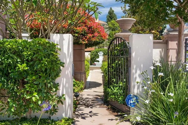 a view of empty room with wooden floor and fireplace